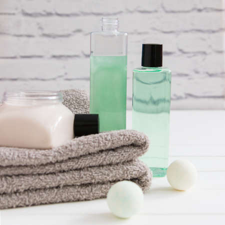 Relax concept gels cream two gray towels square front view.の写真素材