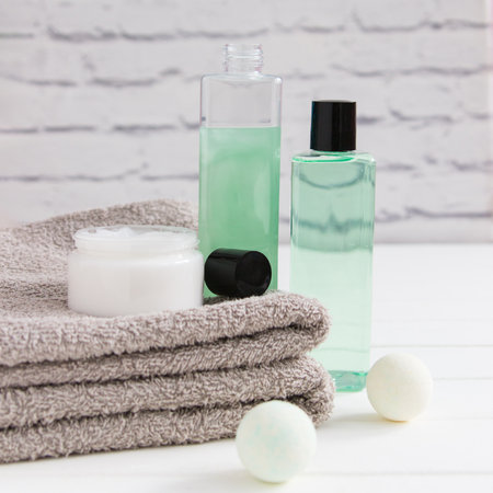 Relax concept gels cream two gray towels square front view.の写真素材