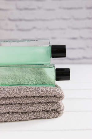 Bath stuff beauty concept two gray towels vertical front view.の写真素材