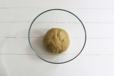 Knead rich dough step by step process glass bowlの写真素材