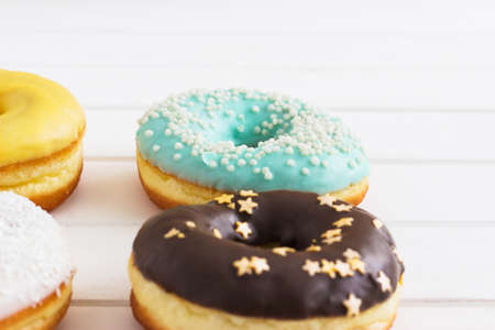 Fried american donuts white background different frostingの写真素材