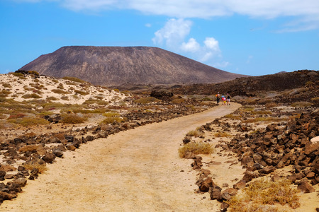 View on the mountain and the road on the island Lobos, belonging to the Canary island Fuerteventura, Spain.の写真素材