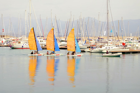 AJACCIO, FRANCE - APRIL 26, 2017: View on the port of Ajaccio and three sailboats with unknown persons - Ajaccio, Corsica Island - France - 26.04.2017.のeditorial素材
