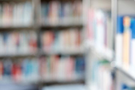 Blur image of shelf with books in library. Can be used as background.の写真素材