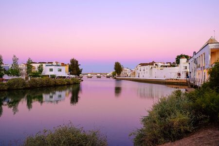 TAVIRA, ALGARVE, PORTUGAL - MAY 25, 2019: View of the old city of Tavira with Gilao and the Roman bridge on the sunset.のeditorial素材