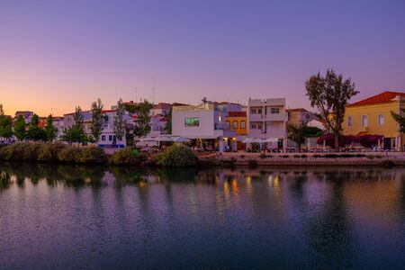 TAVIRA, ALGARVE, PORTUGAL - MAI 25, 2019: View on the old city of Tavira with beautiful white houses and the river Gilao on the sunset.のeditorial素材