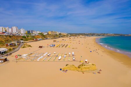 PORTIMAO, PORTUGAL - MAI 24, 2019: View on the beach Portimao with golden sand in Algarve region, Portugal.のeditorial素材
