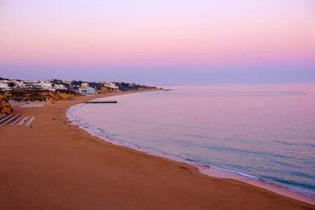 ALBUFEIRA, ALGARVE, PORTUGAL - JUNE 8, 2019: View on the beach of Albufeira on the sunset. Vacation in Algarve, Portugal.のeditorial素材