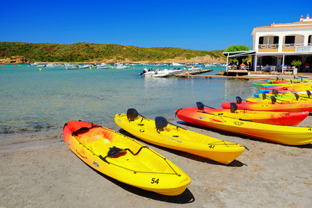 ES GARU, MENORCA, SPAIN - SEPTEMBER â­4â¬, 2019: View on the beach Es Grau with canoes for tourists on Menorca, Balearic Islands, Spain.のeditorial素材