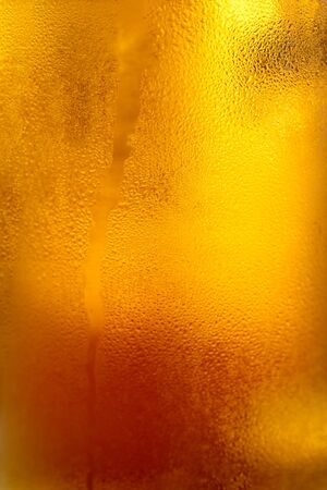 Closeup with fresh light beer. Can be used as background.