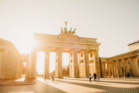 BERLIN, GERMANY - 04.04.2020:  Brandenburg Gate in Berlin with unknown people in a sunny day.のeditorial素材