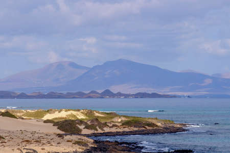 View on the Islands Lobos and Lanzarote from the Corralejo Beach on Fuerteventura.