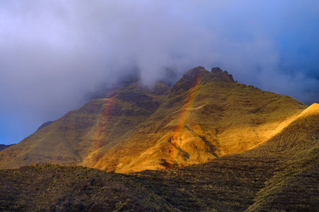 Rainbow in the mountains of the natural park Tamadaba on Gran Canaria - Canary Islands, Spain.の写真素材