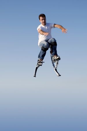 a young man jumping high in the sky