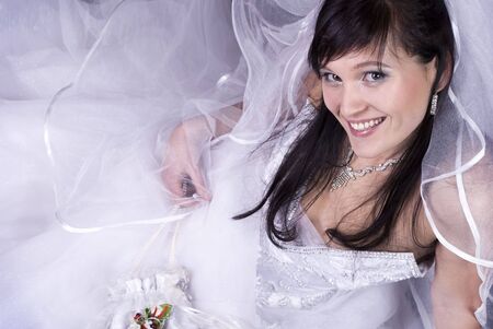 studio portrait of a happy bride