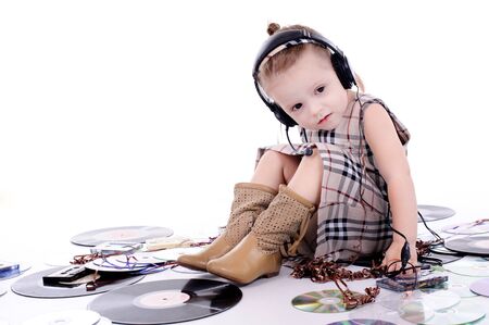 babe playing with tapes and music recordsの写真素材