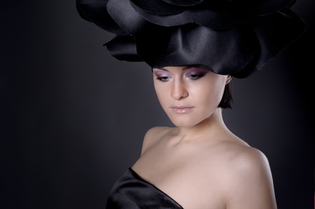 dark portrait of a girl in a dark roses suit の写真素材