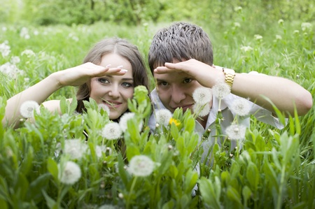 Portrait of young nice peeping  couplの写真素材