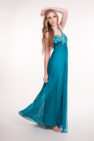 Beautiful young woman wearing a sexy evening dressの写真素材