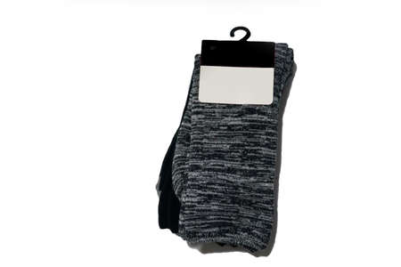 Pair of gray and black socks with label isolated on white background with copy spaceの写真素材