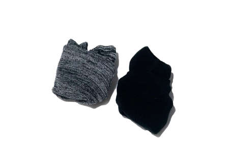 Pair of rolls wool gray black socks isolated on white background with copy spaceの写真素材