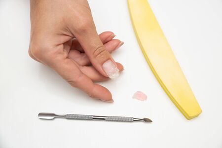 hardware removal of the old shellac from the nails in the salon by the masterの写真素材