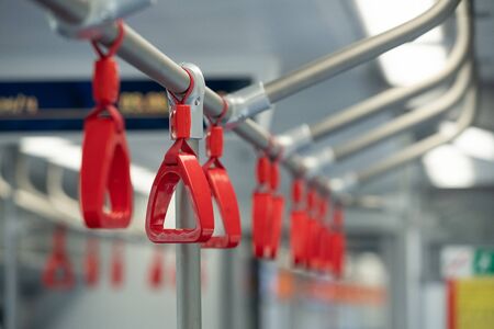 Handles for standing passenger inside a bus.の写真素材
