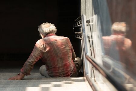 Homeless man on walkway street, Homeless concept.の写真素材