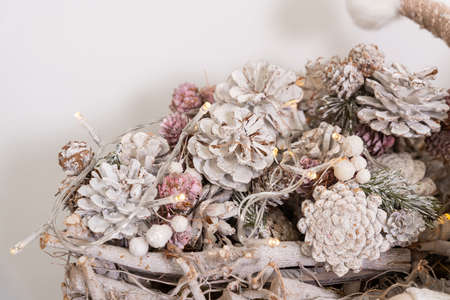 christmas decoration white painted cones in a basketの写真素材