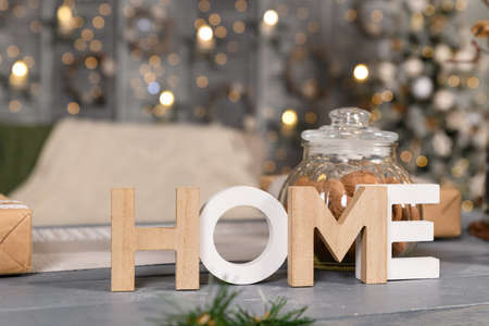 the letters Home on the background of the New Year's interiorの写真素材