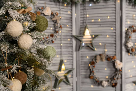 Beautiful bright location with a Christmas tree. Room decoration in New Year's style.の写真素材