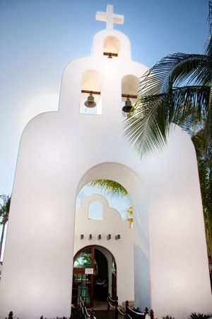 A white church that can be found downtown on 5th Avenue near the port to Cozumel.