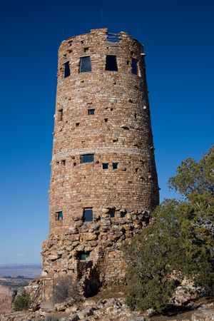 The Desert View Watchtower, constructed in 1932 as a replica of a prehistoric Indian tower, commands a magnificent view of the Grand Canyon, the Painted Desert to the east and the San Fransisco Peaks to the south.の写真素材