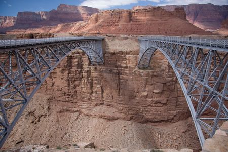 These two bridges, one historic and one new, represent one of only seven land crossings of the Colorado River for 750 miles (1207 km).の写真素材
