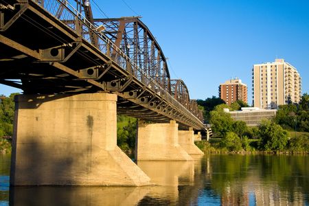 The old Victoria Bridge over the South Saskatchewan River in Saskatoon, Saskatchewan, Canada.の写真素材