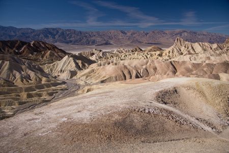 Surrounded by a maze of wildly eroded and vibrantly colored badlandsの写真素材