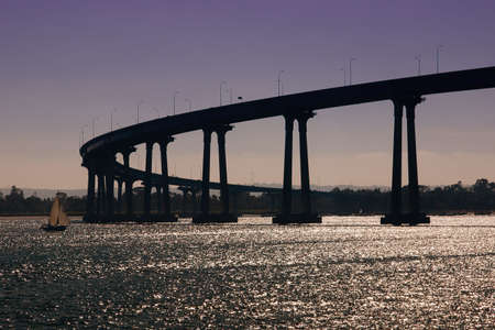 The San Diego-Coronado Bridge, locally referred to as the Coronado Bridge, is a "prestressed concrete/steel" girder bridge, crossing over San Diego Bay in the United States, linking San Diego, California with Coronado, California.の写真素材