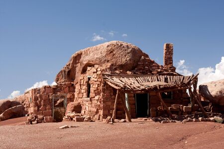 Native American home in Cliff Dwellers, located in Northern Arizona at Marble Canyon and at the foot of Vermillion Cliffs, is known for its unique shaped boulders and rugged terrain.の写真素材