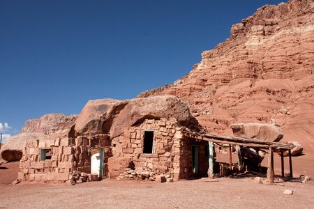 Native American home in Cliff Dwellers, located in Northern Arizona at Marble Canyon and at the foot of Vermillion Cliffs, is known for its unique shaped boulders and rugged terrain.の写真素材