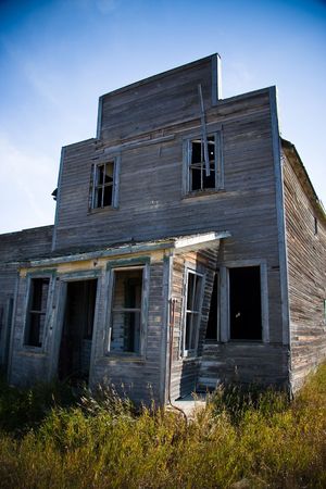 Old rustic and vintage abandoned general store in a prairie ghost townの写真素材