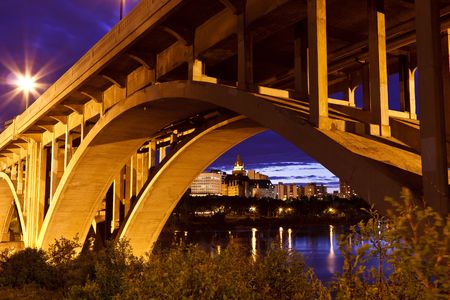 City of Saskatoon, Canada at night as viewed by the Broadway Bridge on the South Saskatchewan River. Processed using HDR.の写真素材