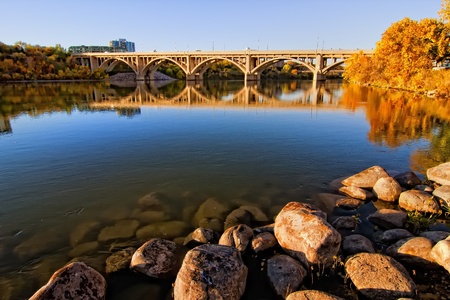 Calm waters of the South Saskatchewan River in Saskatoon, Canada in autumn.の写真素材