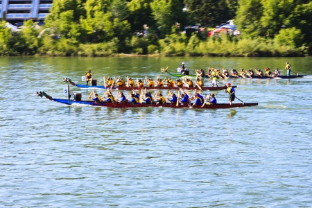 SASKATOON - JULY 24: Athletes fight hard for victory and had fun at the dragon boat racing festival...