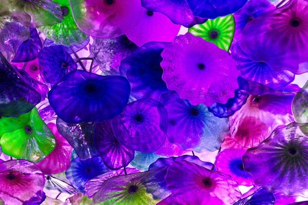 Decorative glass flowers illuminated to provide a special glow