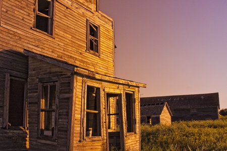 An old-fashioned vintage general store in a ghost town at sunsetの写真素材