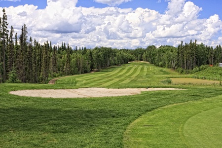 Golf course in the thick forest at Elk Ridge Resort in Saskatchewan, Canadaの写真素材