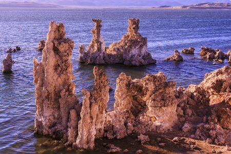 Tufa tower rock formations in Mono Lake are calcium-carbonate spires and knobs formed by interaction of freshwater springs and alkaline lake water.の写真素材