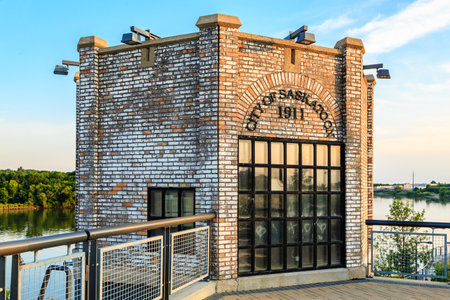 A brick building with a sign that says 1911. The building has a lot of windows