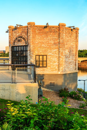 A brick building with a window on the side. The building is old and has a rustic appearance