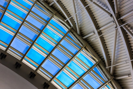 A large, open space with a blue roof. The blue roof is a prominent feature of the space, and it creates a sense of openness and expansiveness. The blue color also gives the space a calmingの写真素材